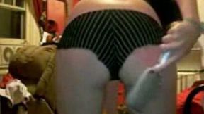 I am slapping my plump booty with a hair brush on webcam