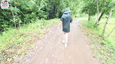 Thai girl walks and shows her pussy on the roadside near a rice field.