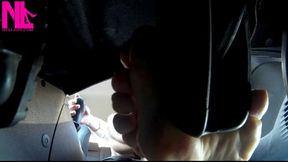 Barefeet footplay in the car_camera under gas pedal