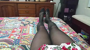 Dani Leg on bed in black pantyhose showing off curvy legs and round ass