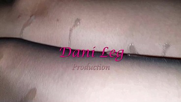 Dani Leg on bed in black pantyhose showing off curvy legs and round ass