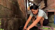 Washing and cutting vegetables in a rural area