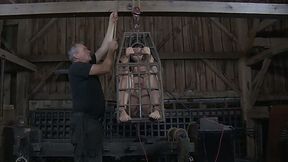 Sasha sits in the tiny cage and blows a dick of a mature BDSM freak