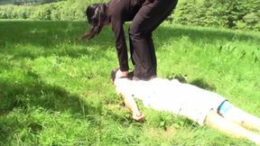 Outdoor trampling punishment with muddy shoes