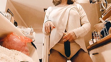 Milf fucking cucumber in kitchen