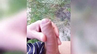 Amateur gay dude is stretching his big dick out in the open