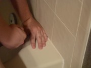Shaved twink practices deepthroating in the shower