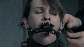 Brunette white girl clipped and pinned with paper clips and chained to the pole