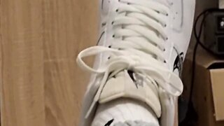 Intimate bedroom encounter: sneakers and passion