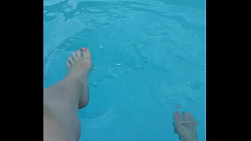 Relaxing my feet at my pool