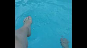 Relaxing my feet at my pool