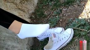 Chinese girl sprains foot in white ankle socks and black leggings