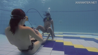 Adeline being filmed by a girl in the pool