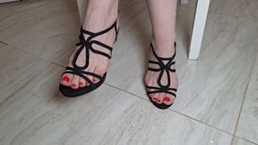 Hostess sore feet in black strappy sandals F