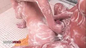 Brunette JAV babe sucks cock in shower close up