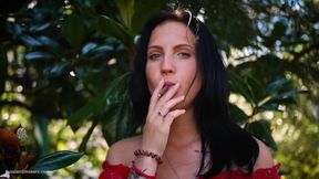 Sultry Brunette in Red Dress Smoking Rolled Cigarette