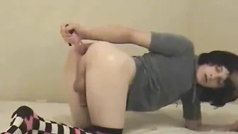 Skinny twink crossdresser Emerson Beddome toys his tight ass solo