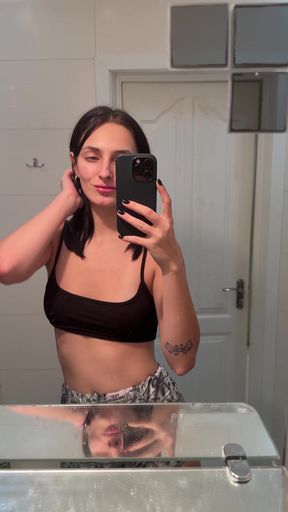 Tattooed tomboy with nipple piercings shows off her ink