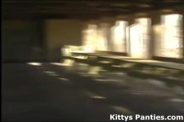 Kitty playing in a football jersey and miniskirt