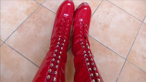 Monique in red hooker boots with rubber dolls