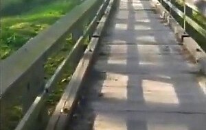 Two men cum together outside