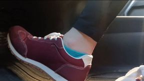 Evalynn driving a loaner truck in red sneakers 3