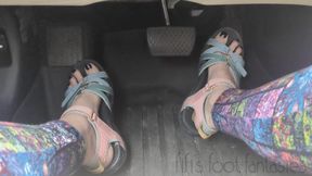 Fifi fast driving in Teva sandals and leggings with black polish