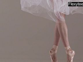 Blonde gymnast performs gymnastics