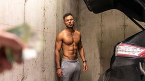 Curly-haired, muscular stud in the parking garage