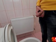 Uncircumcised cock pees on the station toilet