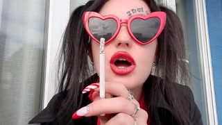 Sexy smoking fetish from Dominatrix Nika. Mistress smokes 2 cigarettes