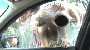 Sexy and wet girl washing car gives a good boobjob