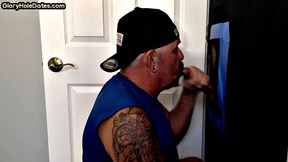 Tattooed amateur gloryhole DILF sucks dick at home