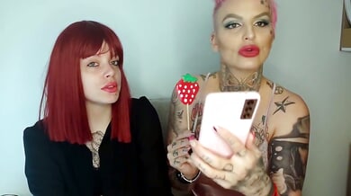 Tattooed Serbian redhead and pink-haired girl flirt on webcam from their living room