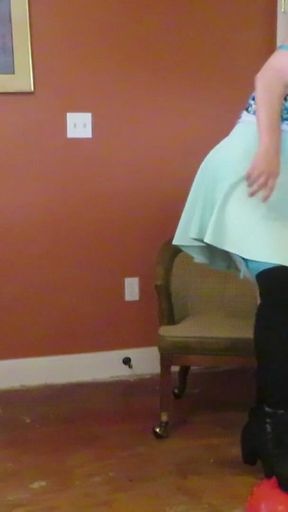 Nurse Vicki  plays with a rubber ball in a mini skirt, sexy stockings and high heel mini boots