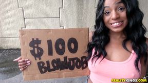 Sexy black girl selling goods on the parking lot
