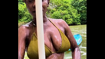 Busty MILF gets soaped up in the jungle