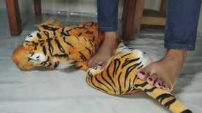 crushing orange stuffed tiger outdoor
