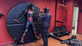 Pup Twink Dressed as Spider-man Strapped to the Bondage Wheel and Milked