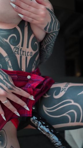 Tattooed beauty in red and black