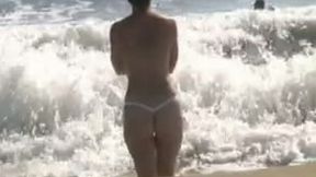 My sexy topless GF allows me to film her on a beach