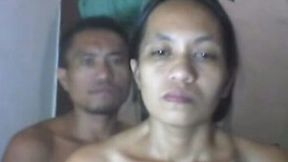 Mature webcam couple poses all naked in their messy bedroom