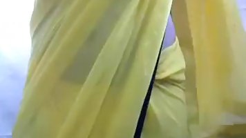 Busty lady is touching her tits in front of a web camera, just for fun