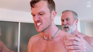 A young guy was fucked by a gang of older men with huge cocks in a hardcore scene