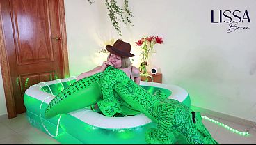 Lissa Brown, safari explorer, inflating an inflatable croc