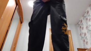 Chav lad jerks off a big cock in sweatpants and black sneakers