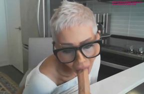 Short haired mature woman fucks her dildo