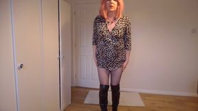 Strawberry blonde in leopard print minidress, fishnets and boots