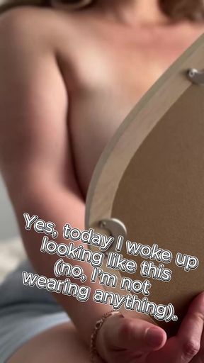 A magical mirror, and behind it, a MILF's large bare breasts