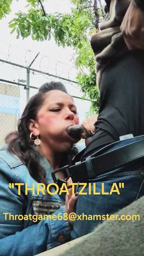 Throatzilla gives a sloppy bbc blowjob in broad daylight on a public sidewalk.